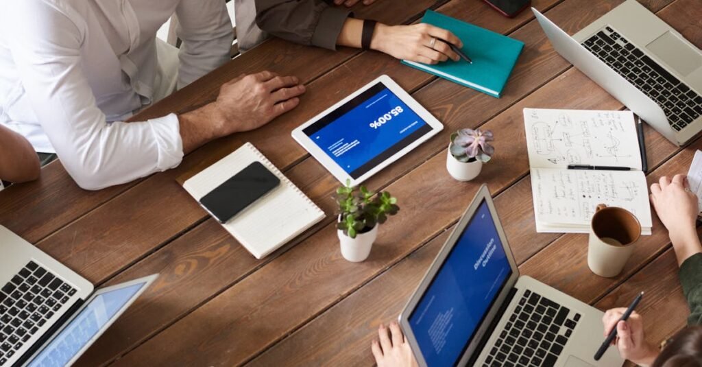 High angle view of a diverse team in a modern office setting discussing a business project.